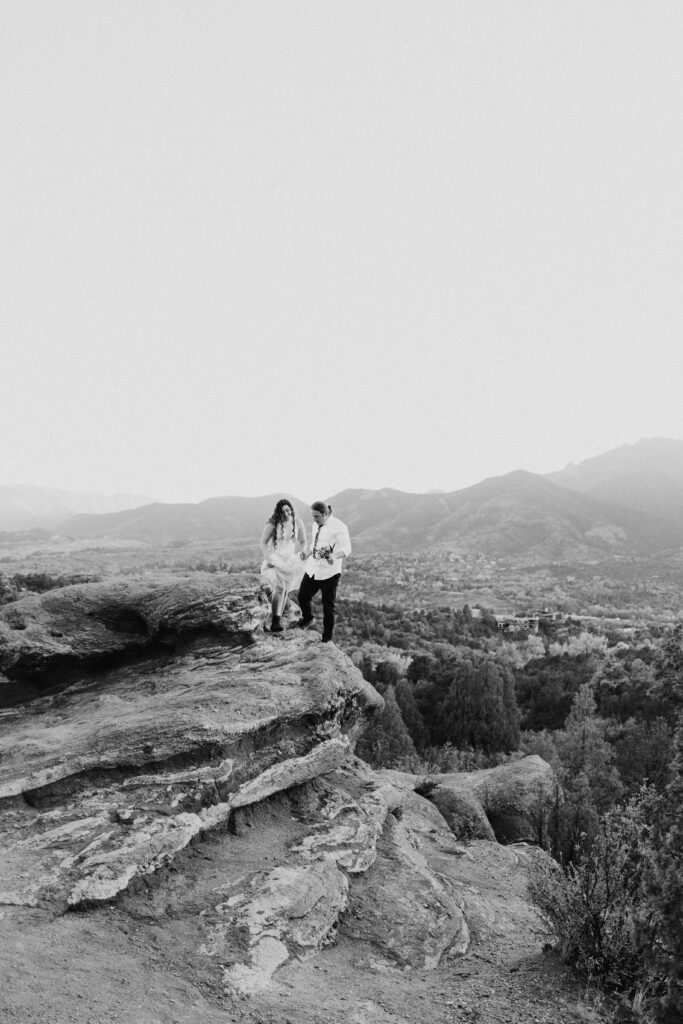 walking on the edge of the red rocks from colorado elopement