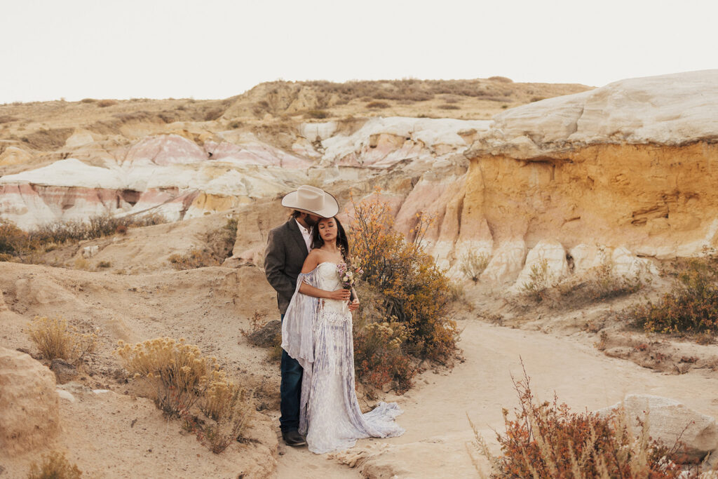 amazing newly eloped couple looking at each other at paint mines