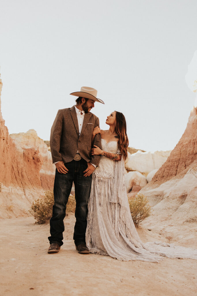 couple hugging looking at each other during their beautiful boho elopement session in colorado | Andrew & Chelsey's Beautiful Boho Elopement in Paint Mines, Colorado
