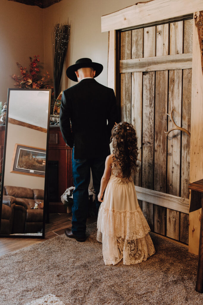 groom and flower girl first look