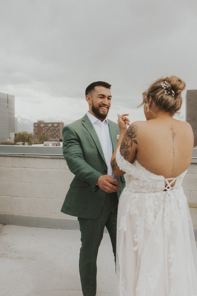 bride and groom doing a first look on a rooftop in salt lake city