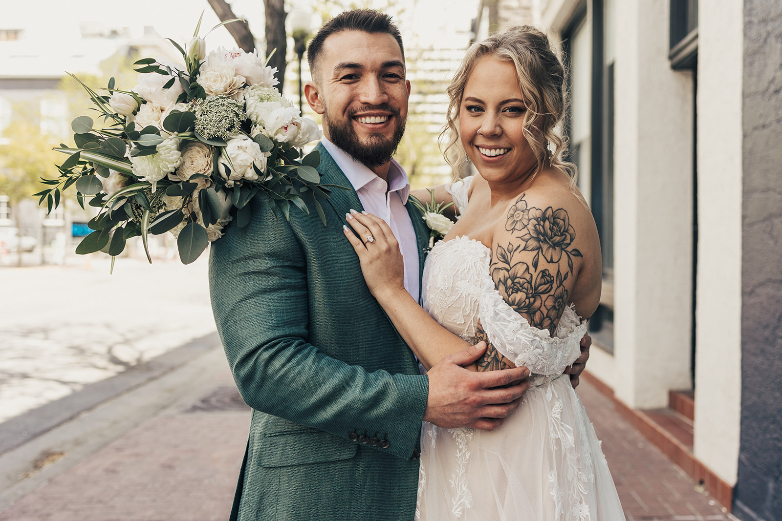 couple posing in downtown salt lake city for their wedding portraits