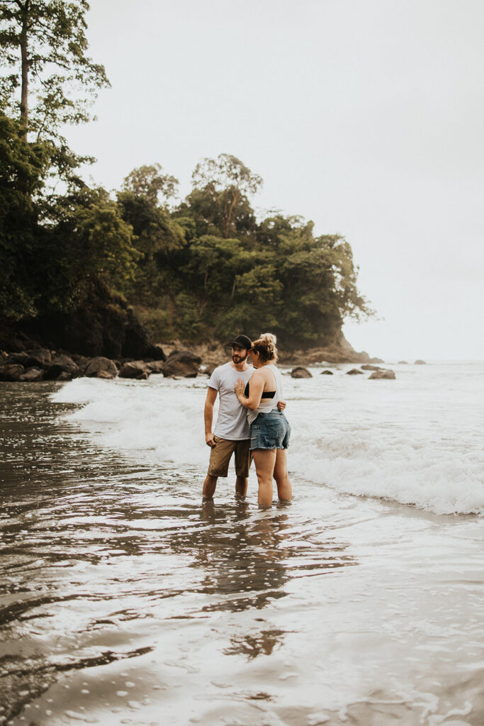 couple posing on the beach in costa rica