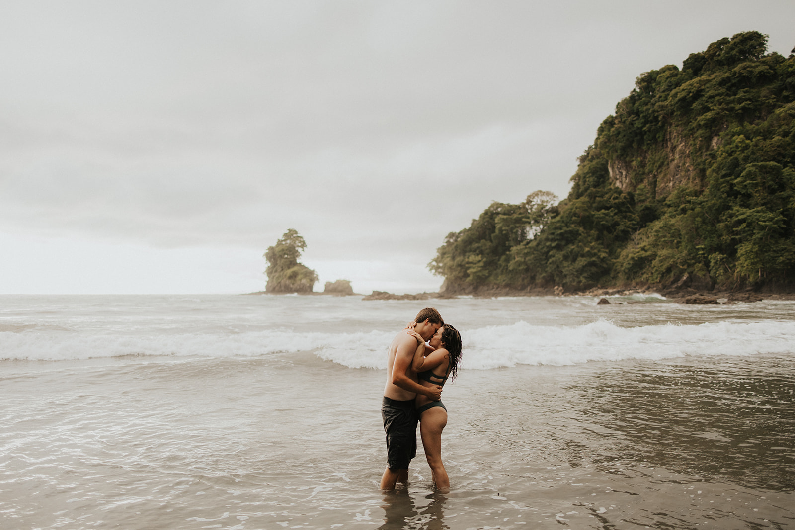 couple posing on the beach in costa rica