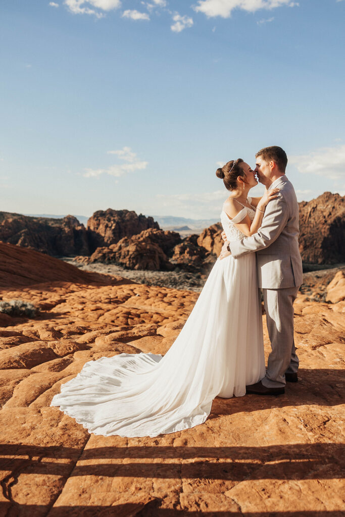 Couple posing for their wedding photos at snow canyon state park