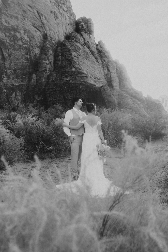 Couple posing for their wedding photos at snow canyon state park
