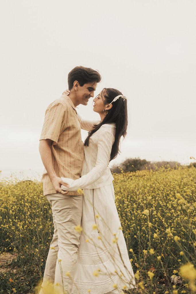 couple posing for their elopement photos in a costa rica field

