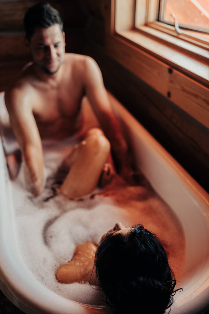 couple posing in a bubble bath