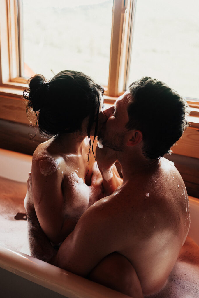 couple having a steamy photoshoot in wyoming
