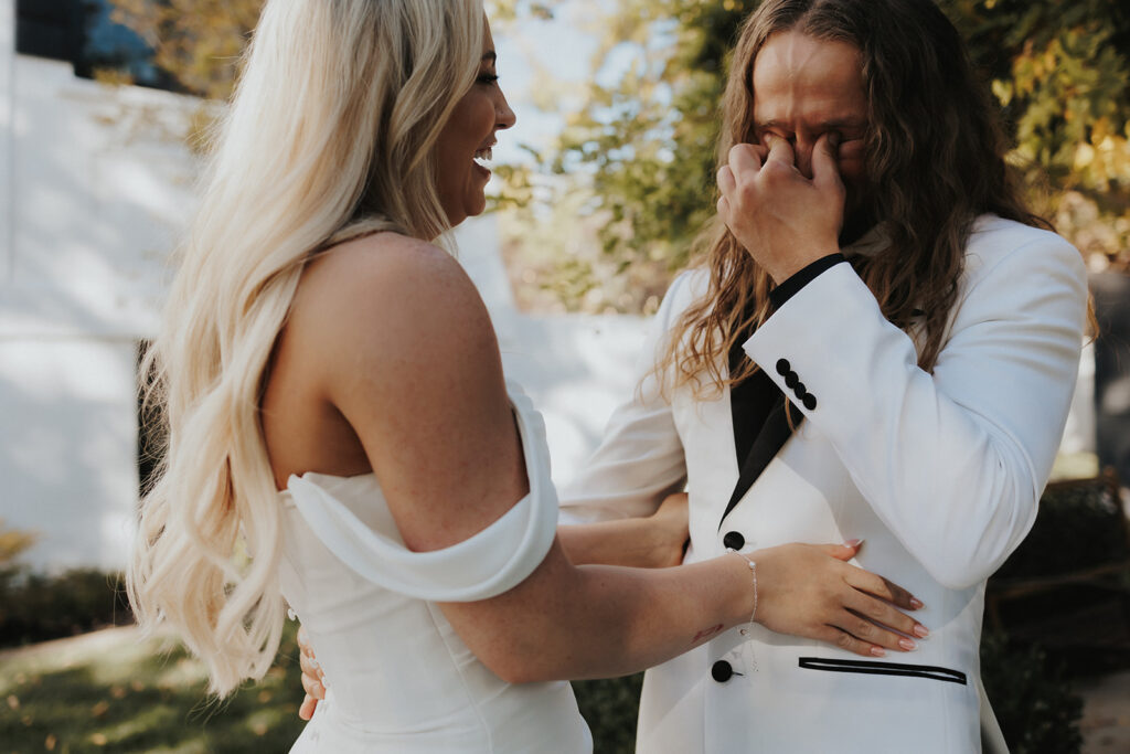 groom emotional after seeing the bride in her wedding dress for the first time