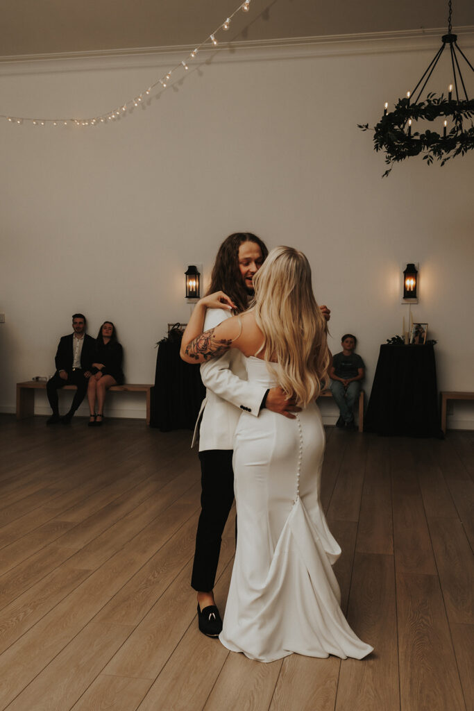 beautiful bride and groom dancing at their intimate wedding