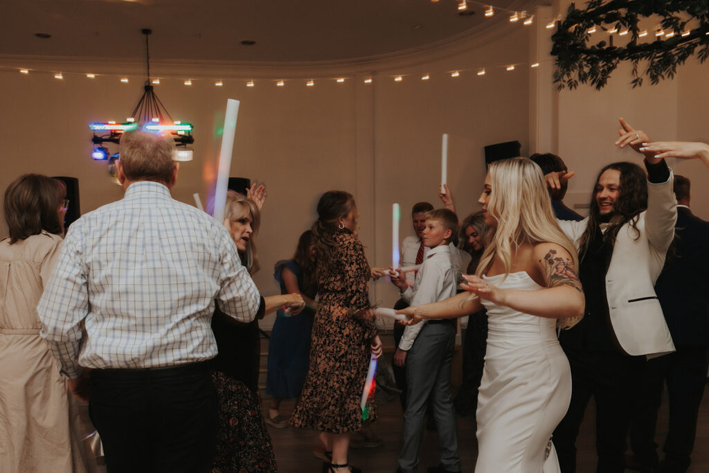 bride and guests dancing at her intimate wedding