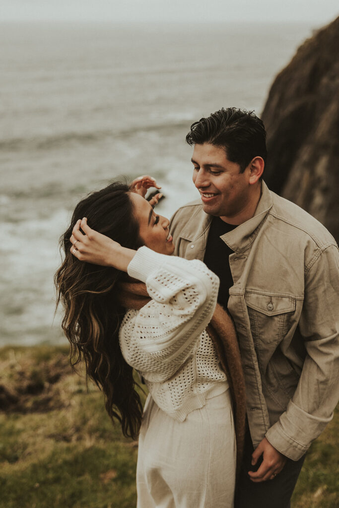 couple smiling during their adventurous couple session
