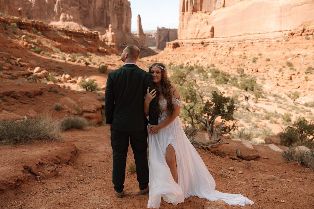 bride and groom at their Romantic and Adventurous Elopement at Arches National Park