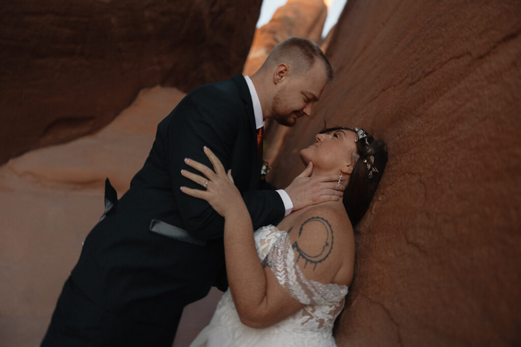 happy newly eloped couple looking at each other at their romantic and adventurous elopement 