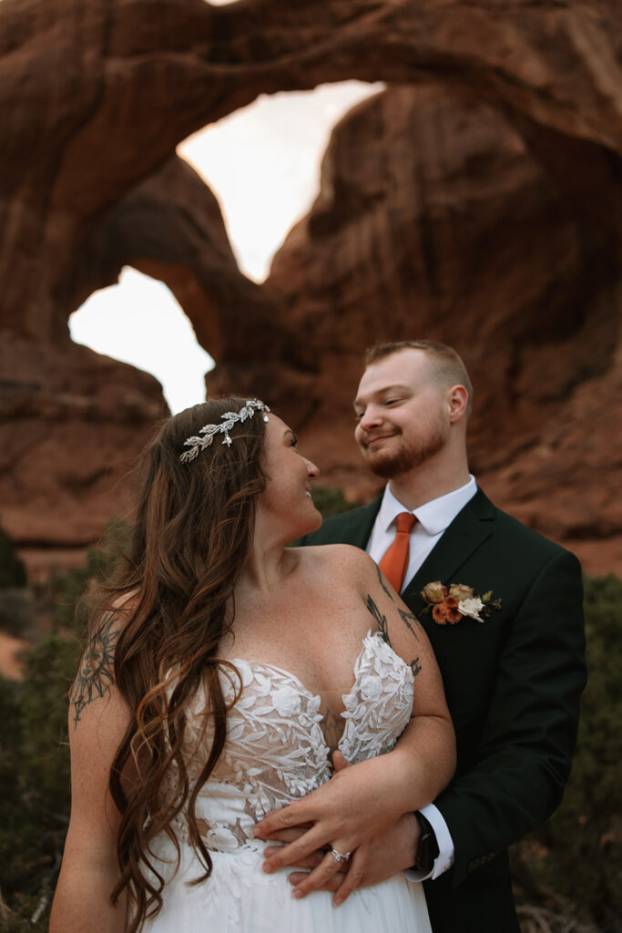 bride and groom looking at each other 