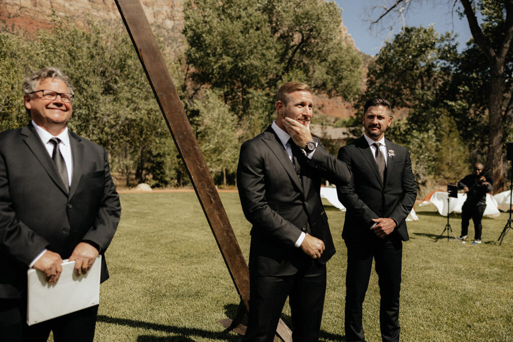 groom seeing the bride walk down the aisle