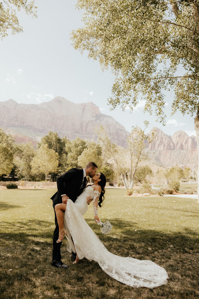 bride and groom kissing after their wedding ceremony 