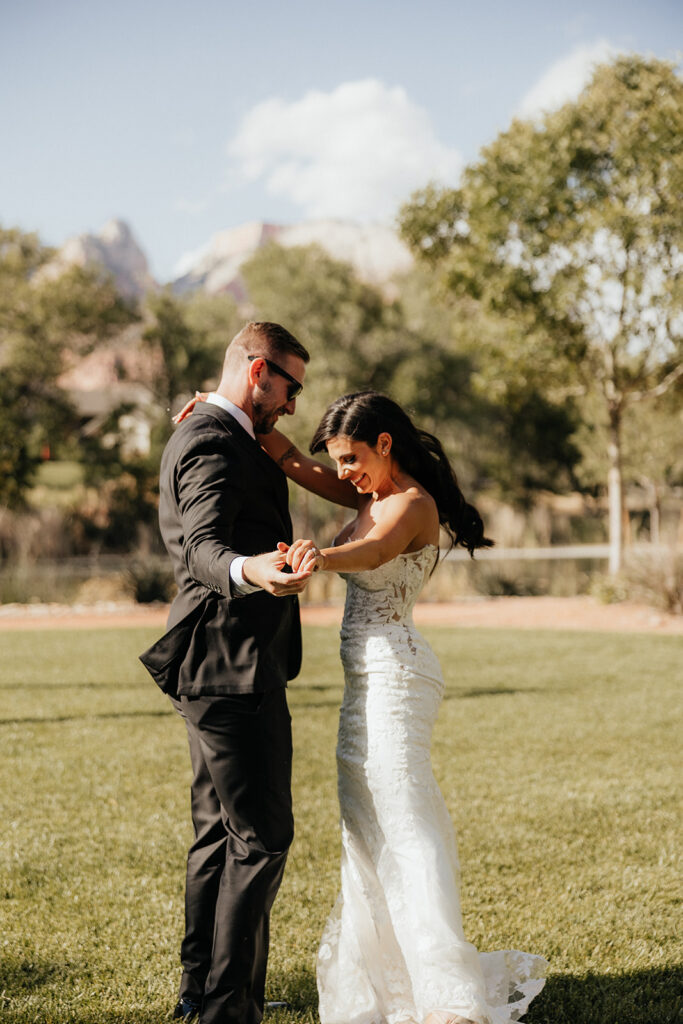 happy newly married couple dancing at their wedding reception