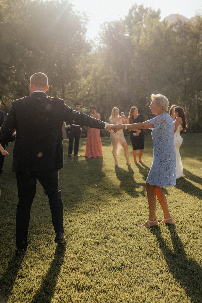 bride and his mom dancing 