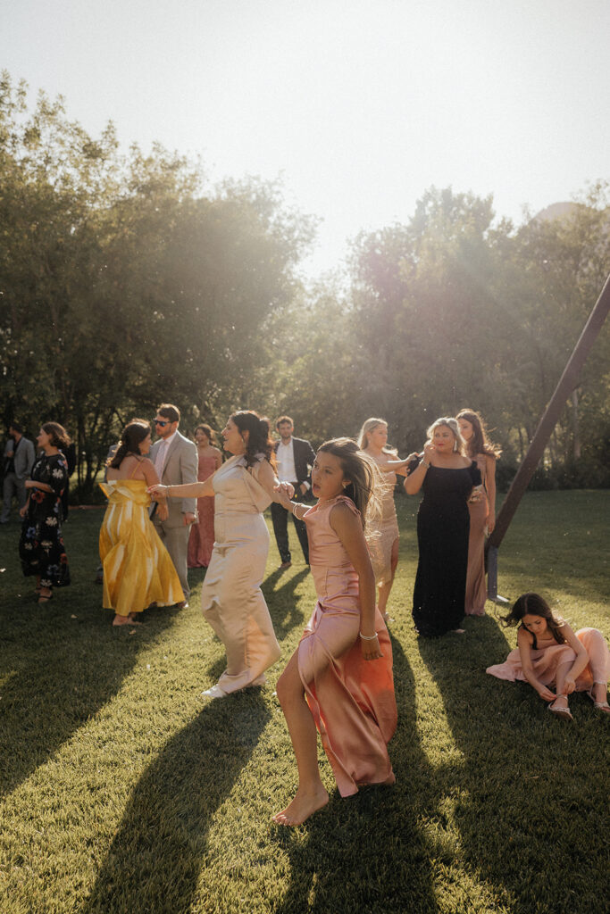 bride and her bridesmaids dancing