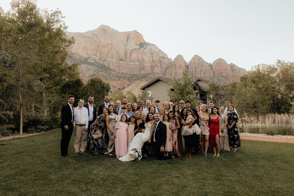 portrait of the bride and groom with their wedding guests