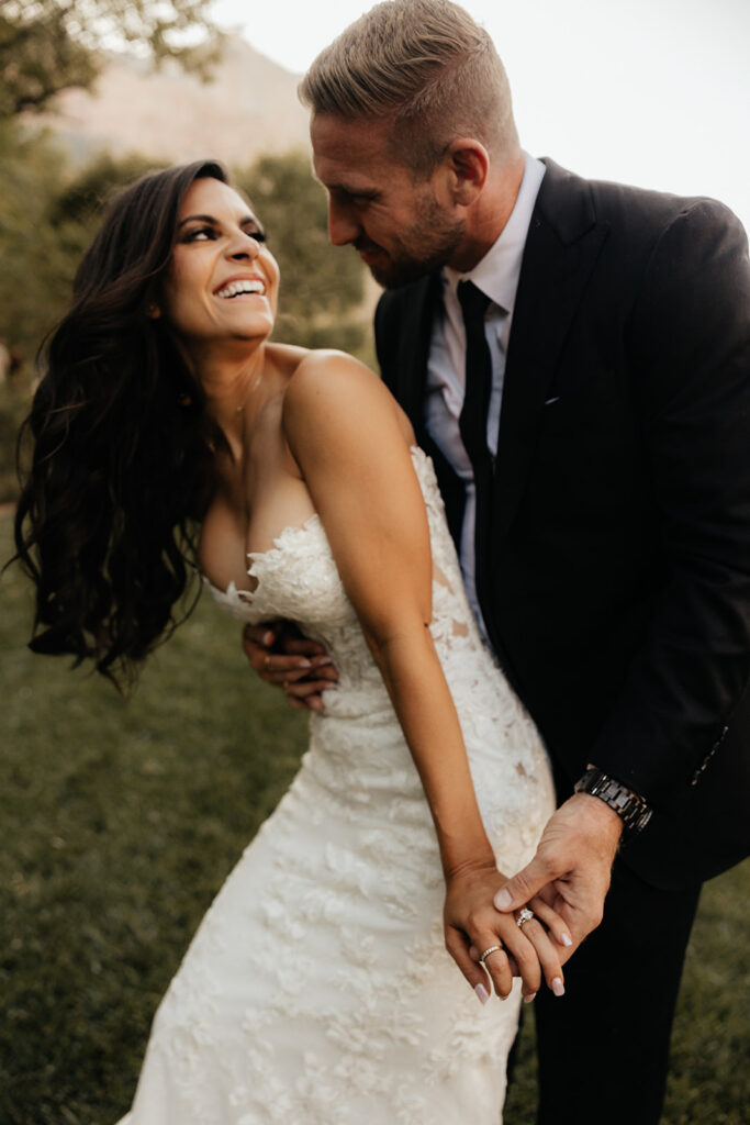 bride and groom hugging looking at each other