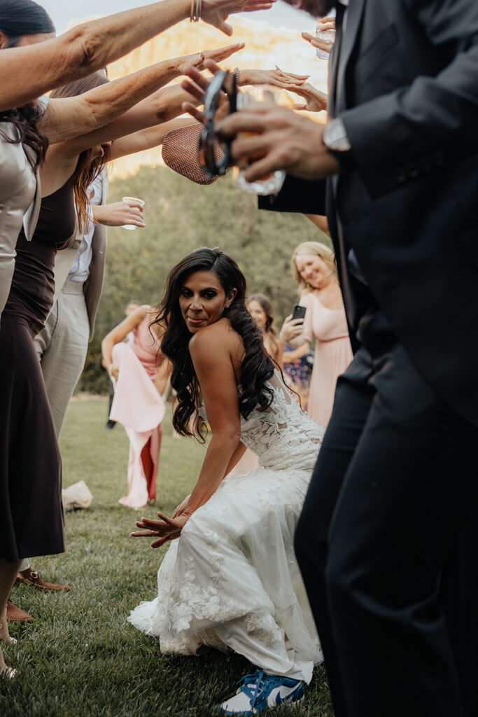 bride and groom leaving their elegant and adventurous wedding party