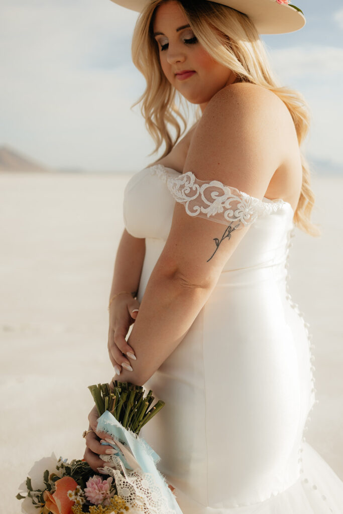 bride holding her colorful wedding bouquet 