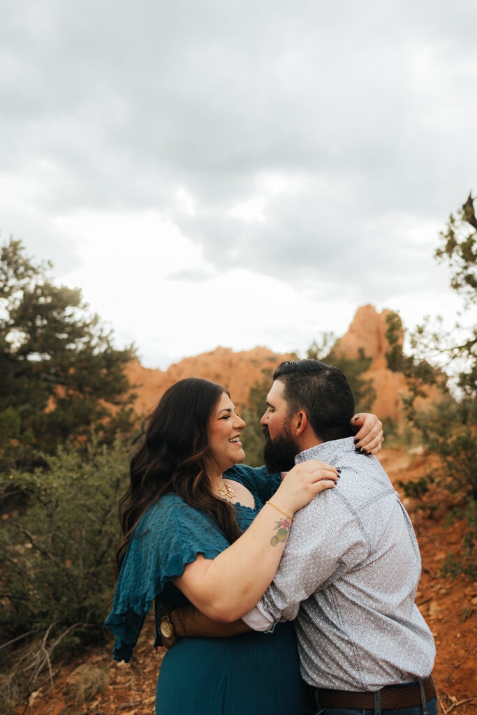 couple laughing with each other during their engagement photos