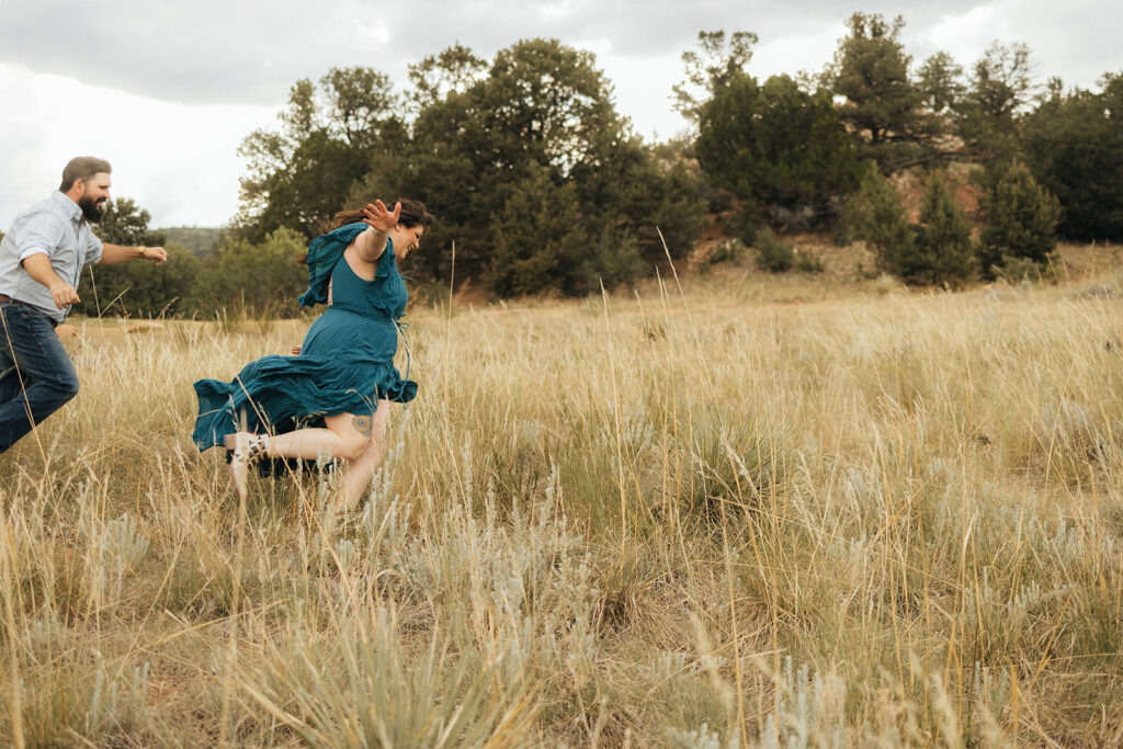 couple running around during their photoshoot