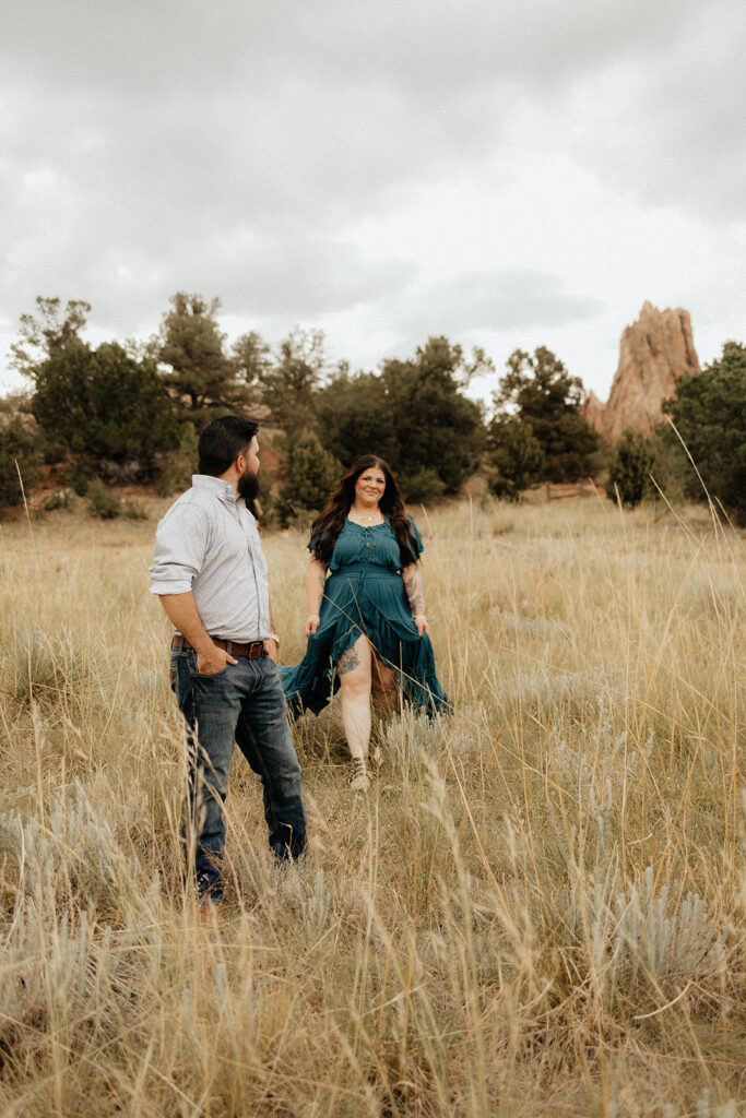 newly engaged couple looking at each other 