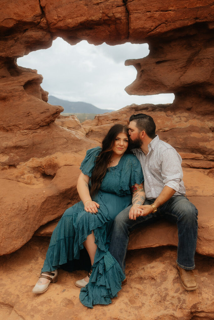 fiance kissing his fiance on the forehead 