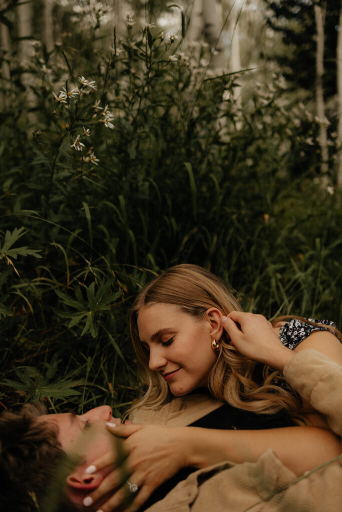 newly engaged couple looking at each other