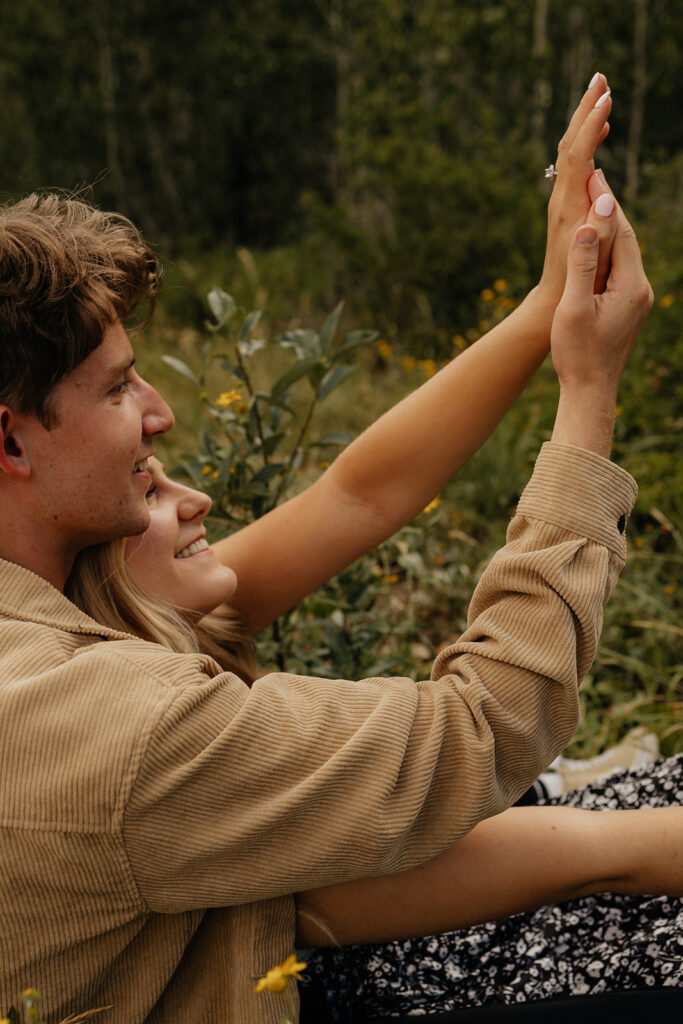 couple looking at their engagement ring