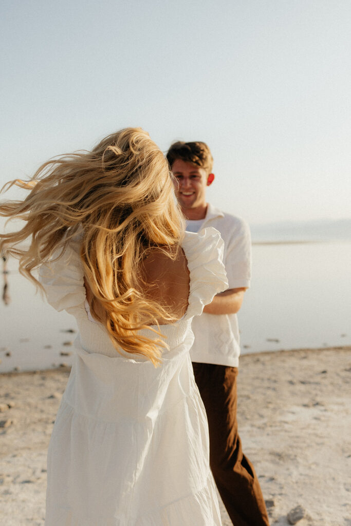 playful beach engagement session