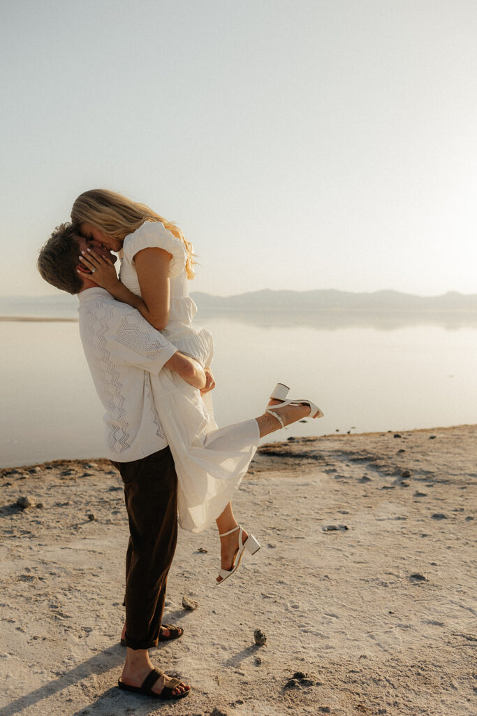 couple kissing at their romantic engagement session