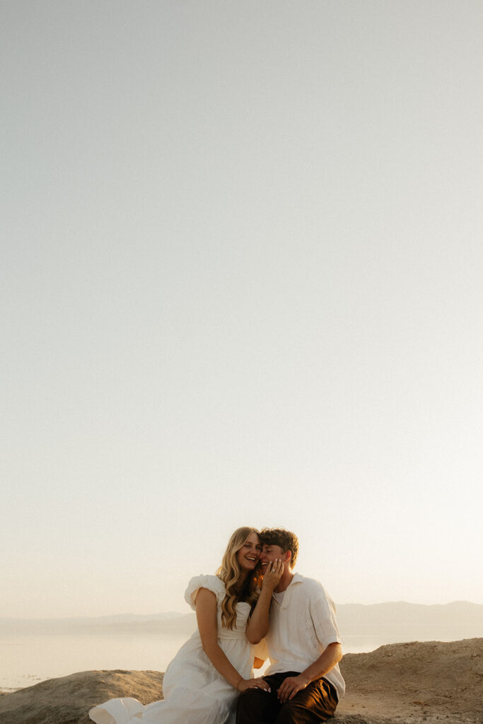 fiance kissing his fiance on the cheek