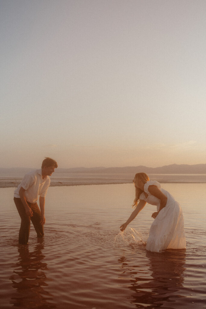 couple playing at the beach 