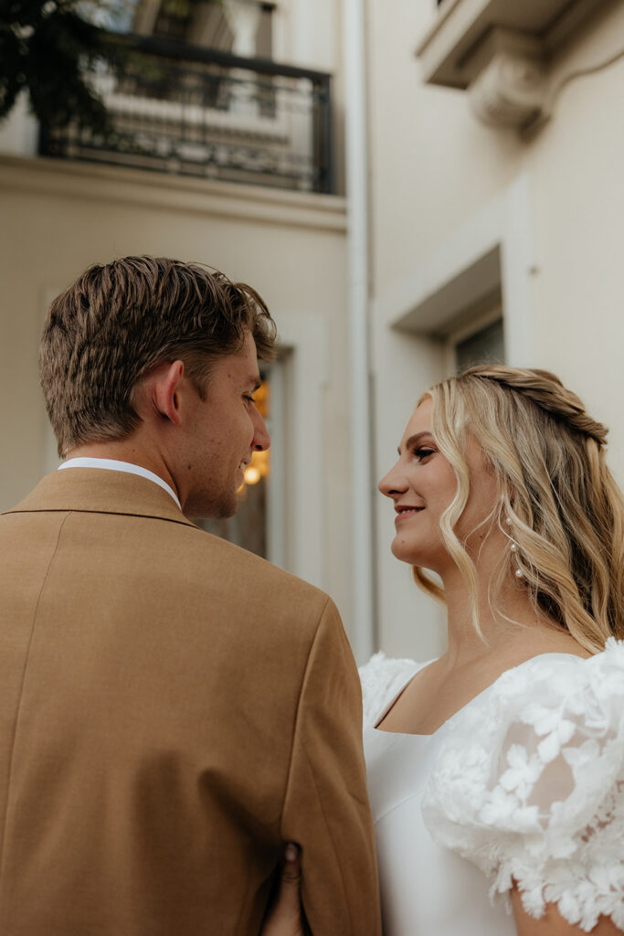 picture of the bride and groom smiling at each other