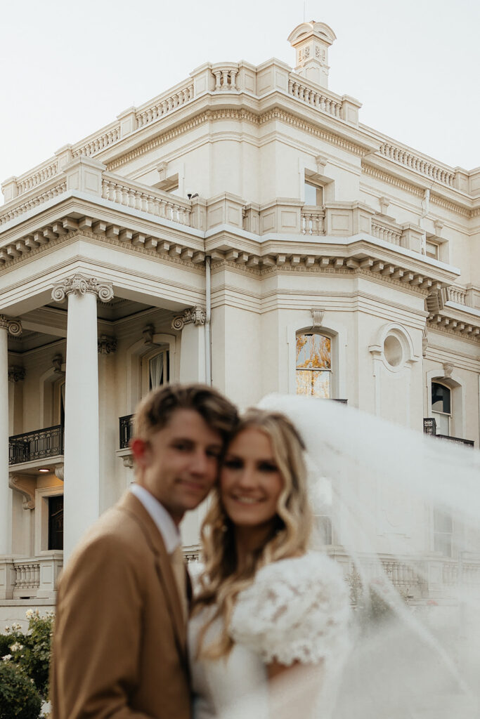couple smiling at the camera during their session