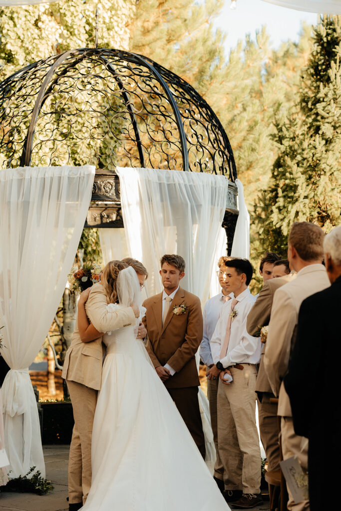bride and her dad hugging at the altar