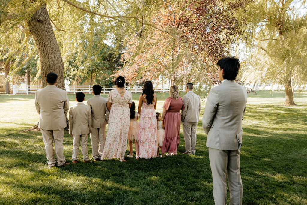 groom at his first look with his family