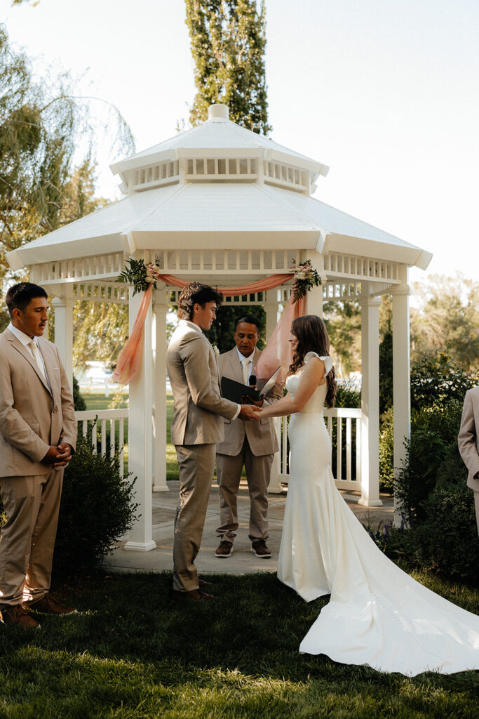bride and groom holding hands during their intimate ceremony