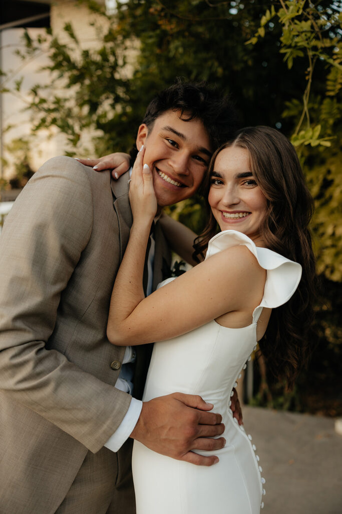 couple smiling at the camera during their session