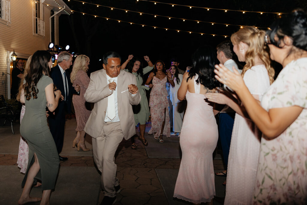 wedding guests dancing at the reception party