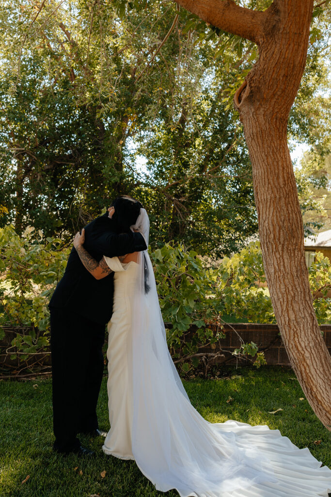 cute picture of the bride and her dad hugging