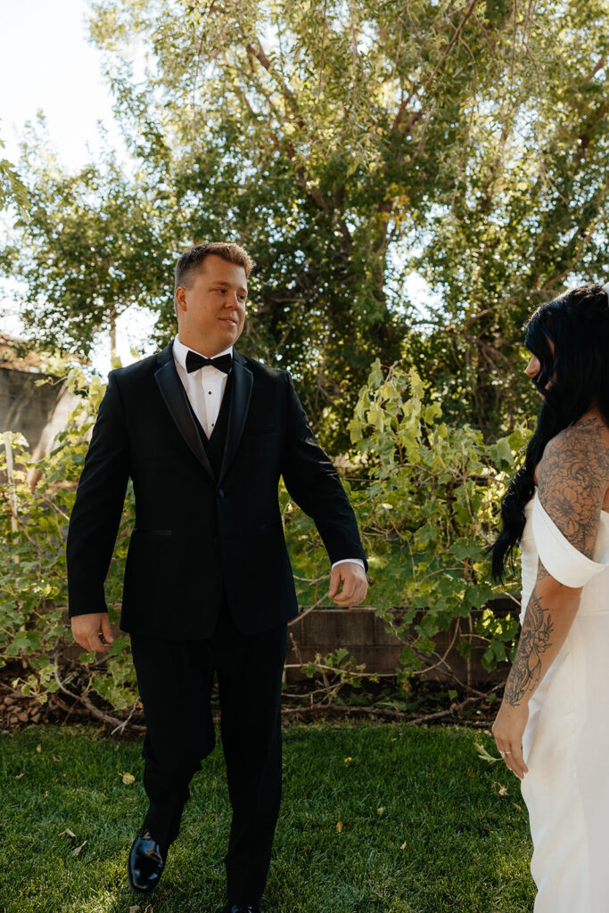 groom emotional seeing the bride in her wedding dress