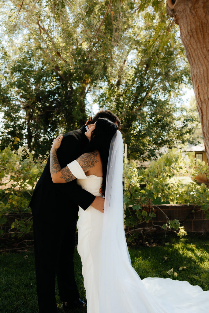 cute picture of the bride and groom hugging 