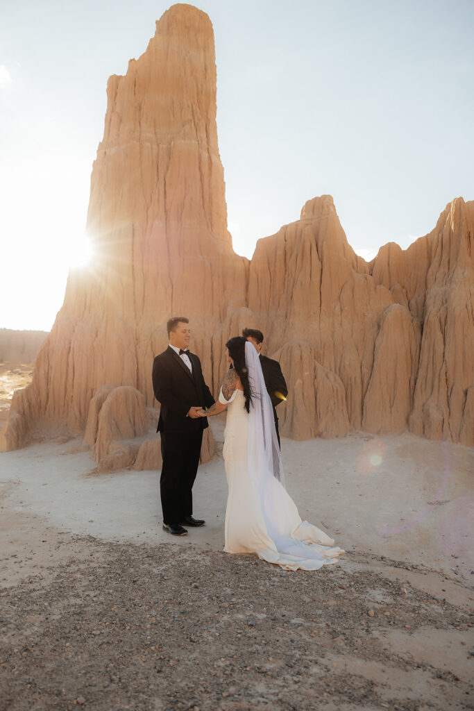 bride and groom holding hands during their ceremony